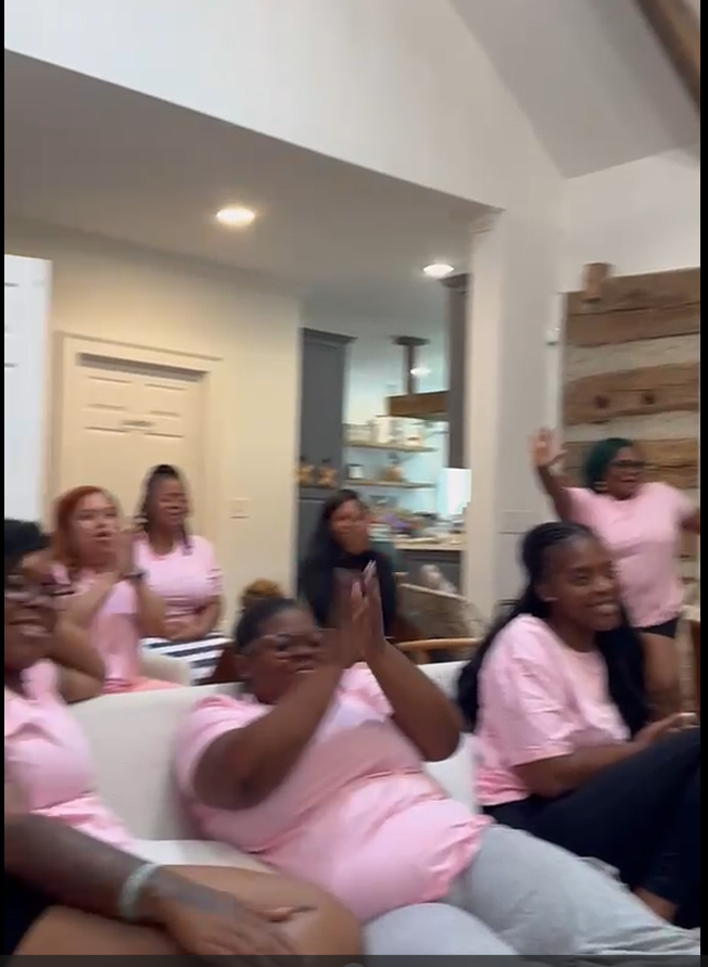 Women in R.I.S.E. retreat t-shirts responding together during a session