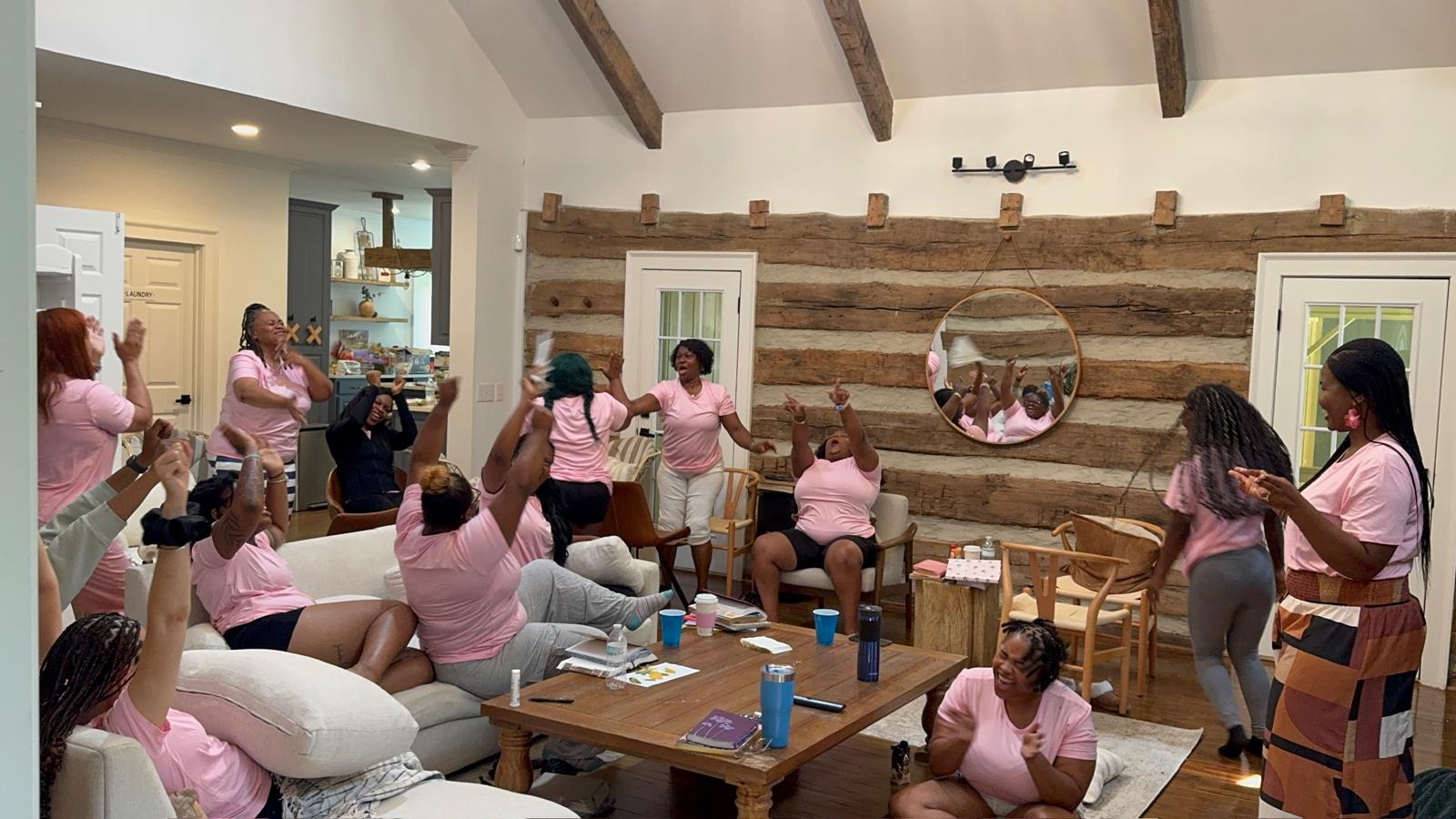Women celebrating and encouraging one another together at the R.I.S.E. Women's Retreat