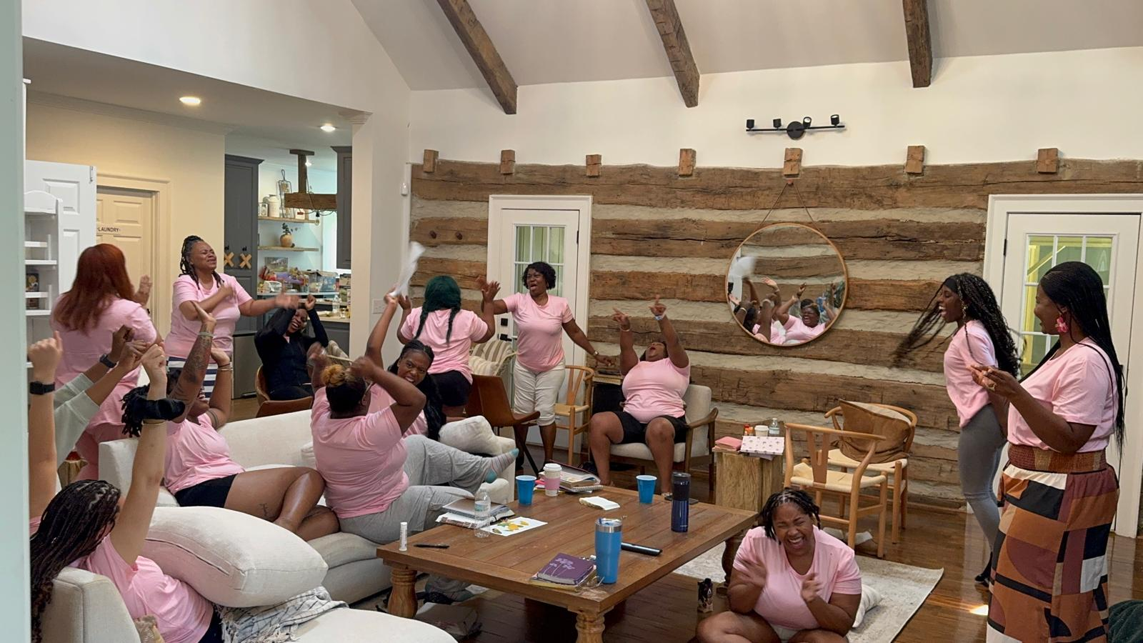 Women celebrating together in the retreat great room at the R.I.S.E. Women's Retreat